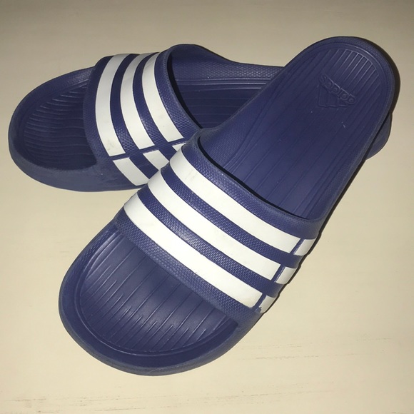 blue and white adidas slides